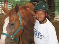 boy and horse at camp