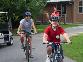 camp volunteer biking
