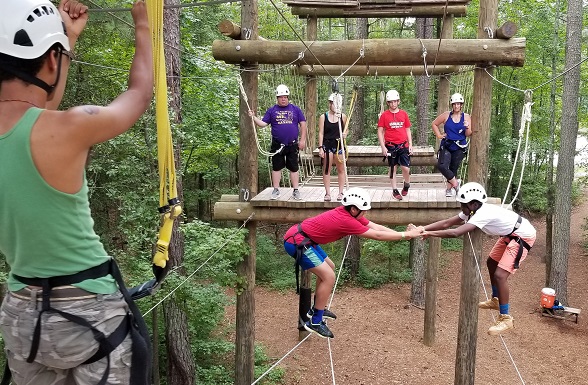 Teen boys on ropes course at Camp Wannaklot