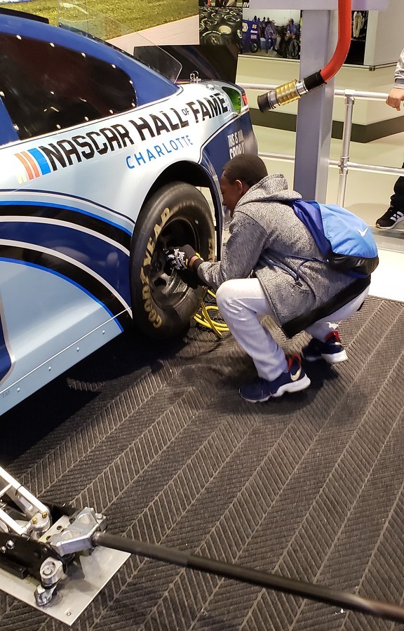 kid changing tire