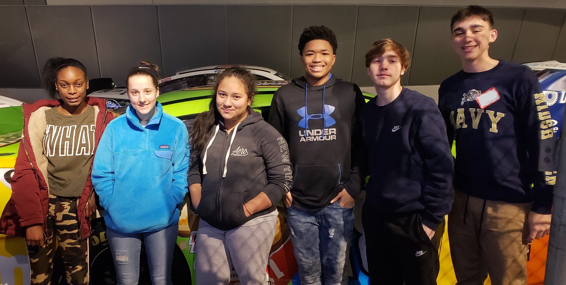 kids in front of a car