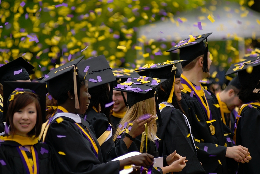 college grads with confetti on caps