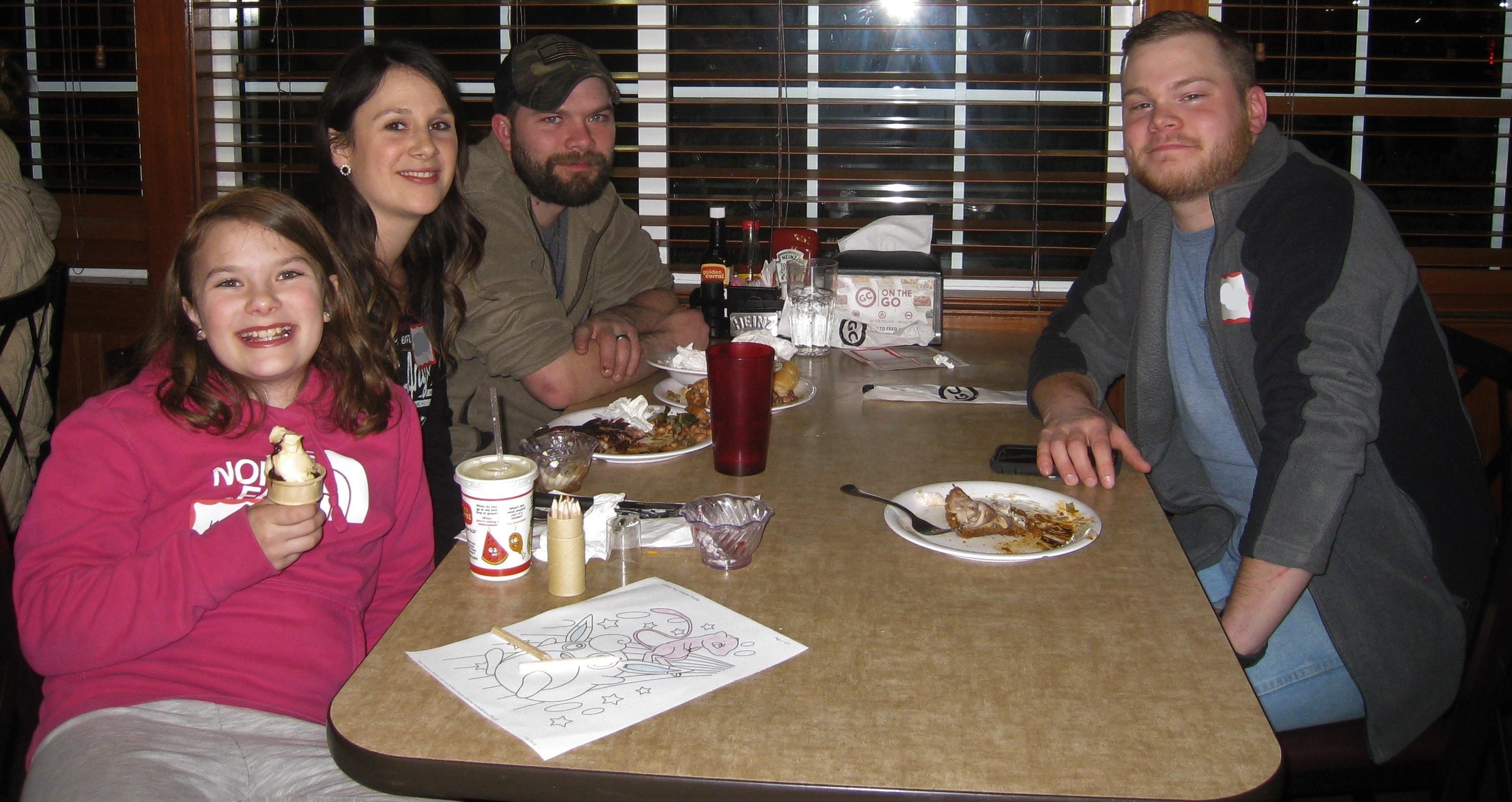 four people at diner table