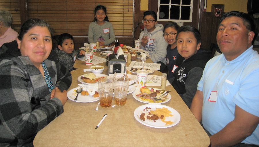 parents and five children at diner table