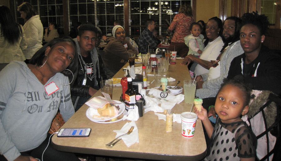 large group of people sitting at a table