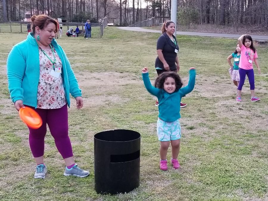 mother and daughter playing paddleball