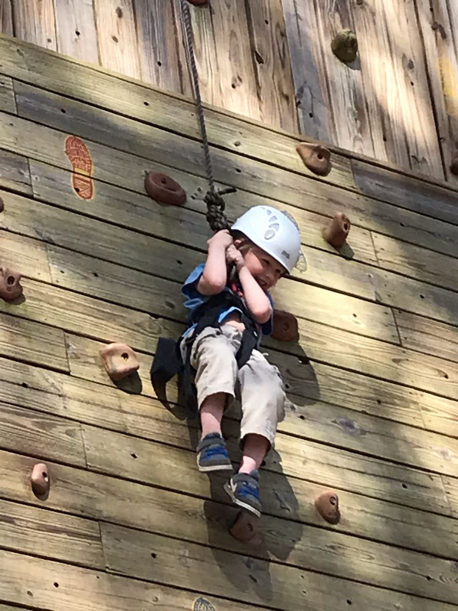 boy on climbing wall