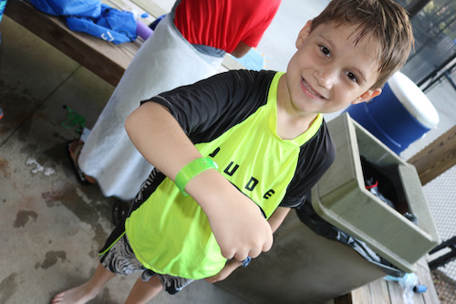 kid showing off his green band