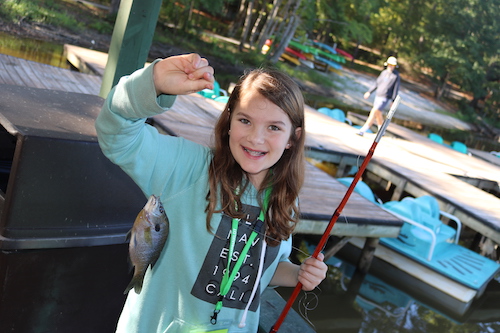 girl holding a fish