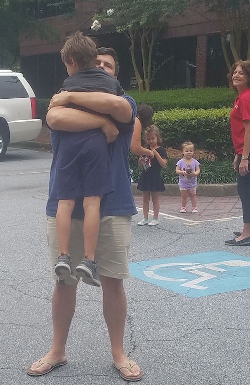 dad hugging son
