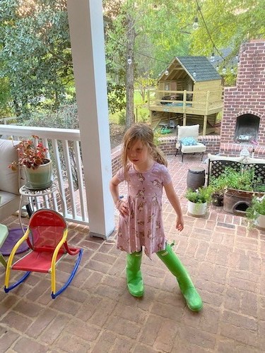 camp 2020 little girl in rain boots