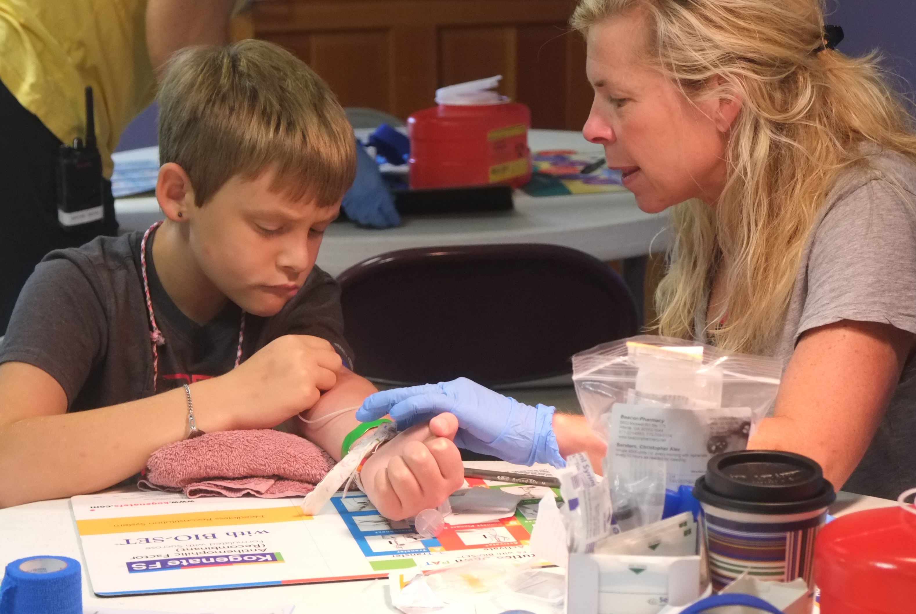 Karen Clark and boy infusing at Camp Wannaklot