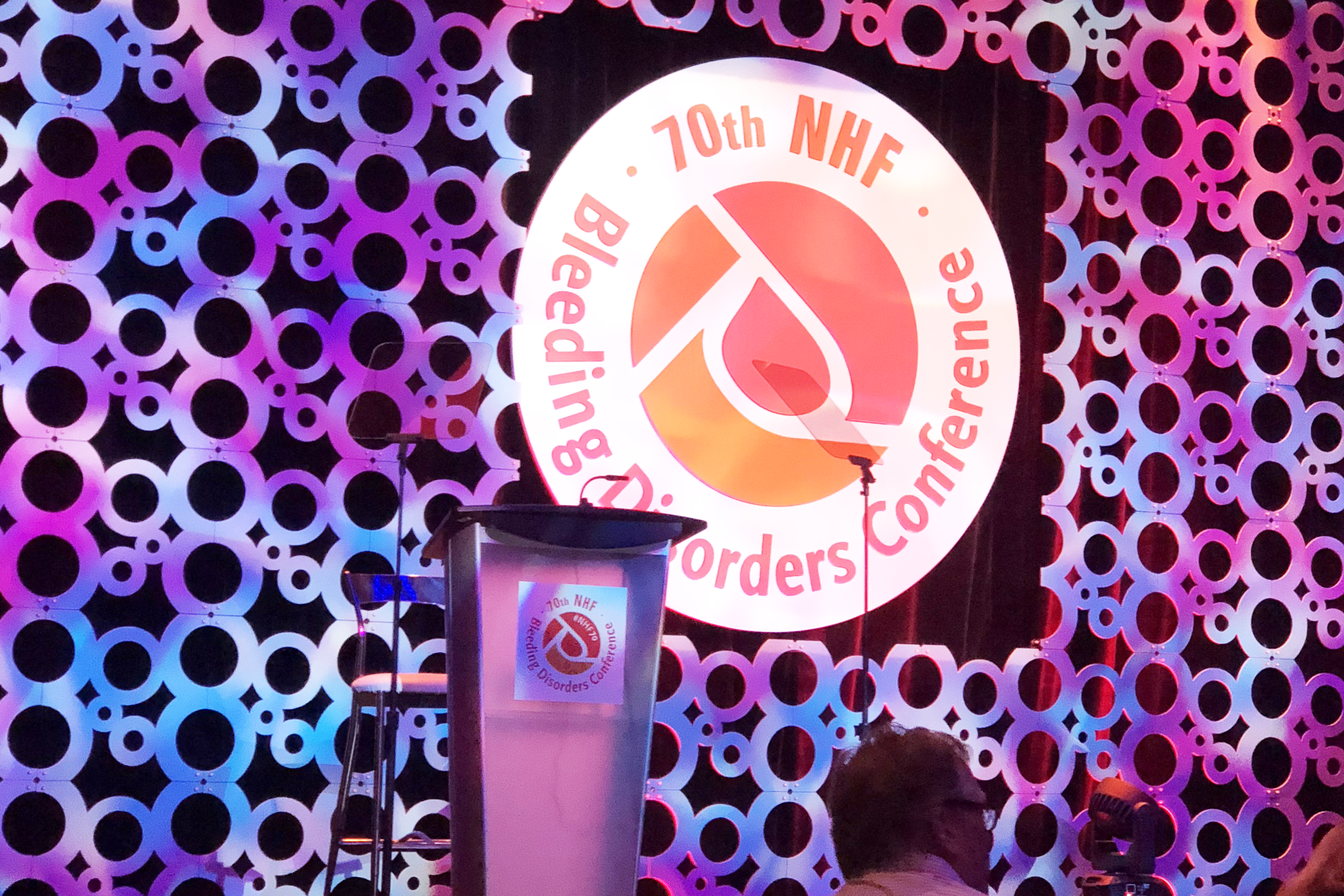 2018 National Hemophilia Foundation Conference in Orlando Logo and Podium