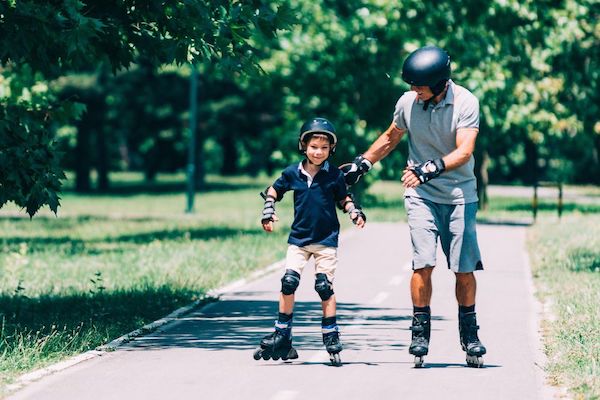 Father and son rollerblading