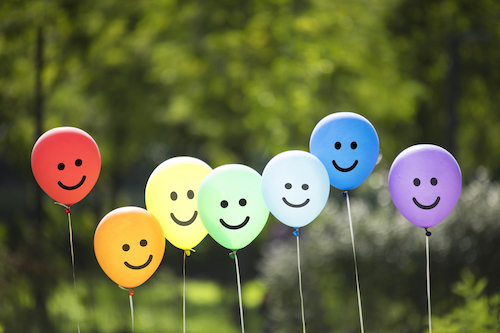 happy balloons with smiling faces on them