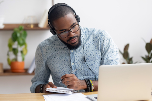 man focused on laptop