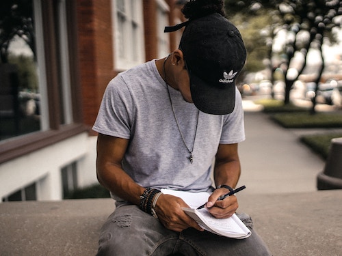 Man writing in notebook