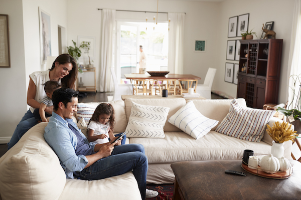 family playing ipad on couch