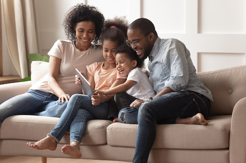 African American Family looking at a tablet