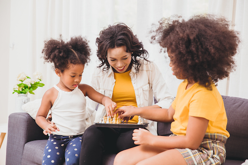 family playing game on couch